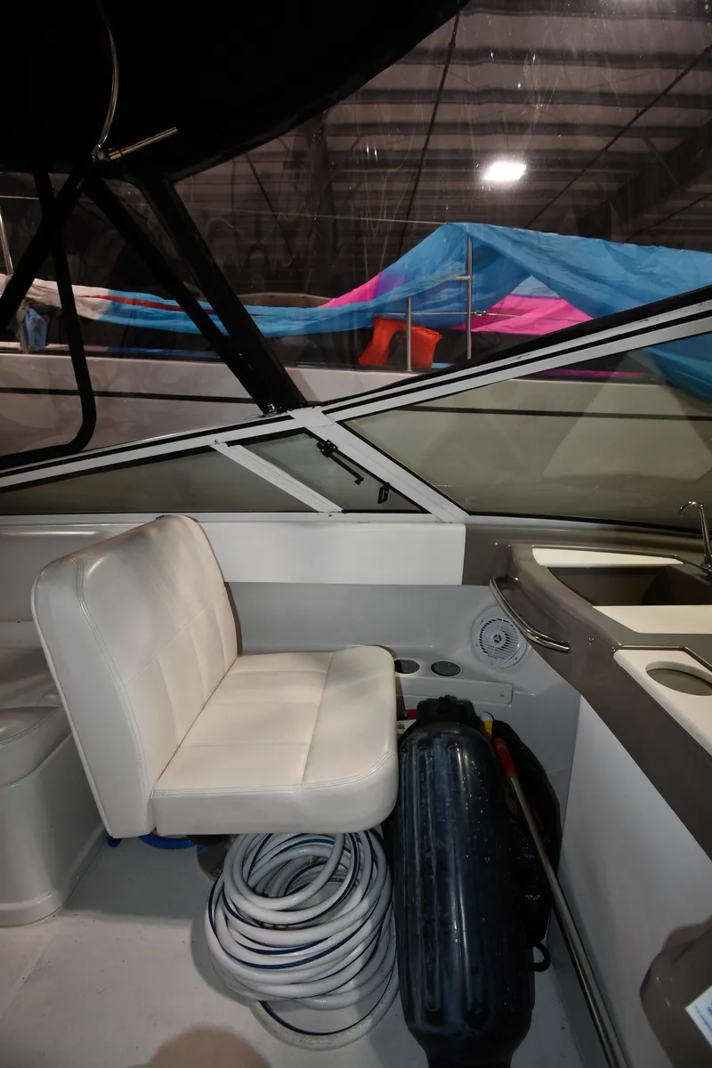 Slide: The Image of 2000 Carver 350 Mariner interior with white seating and nautical equipment. - 19