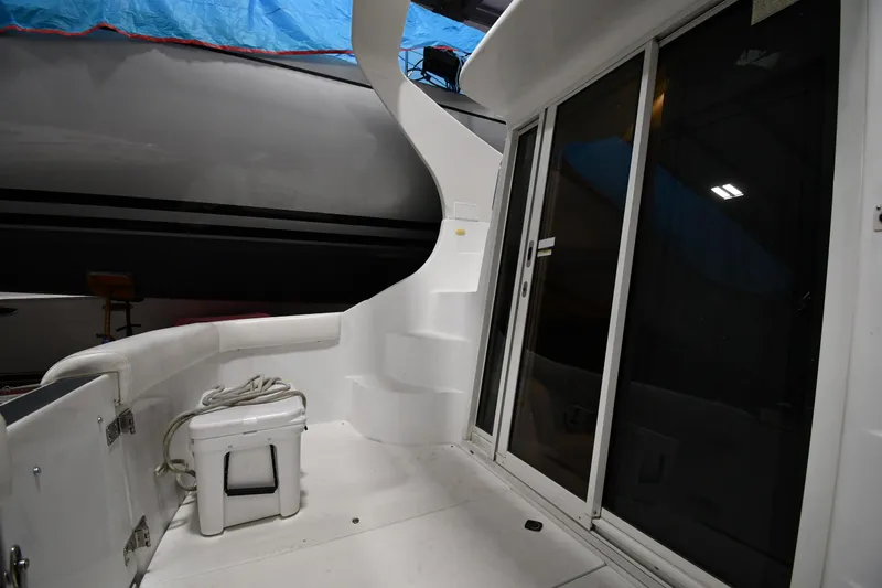 Slide: The Image of 2000 Carver 350 Mariner yacht deck with sliding glass doors and steps. - 22