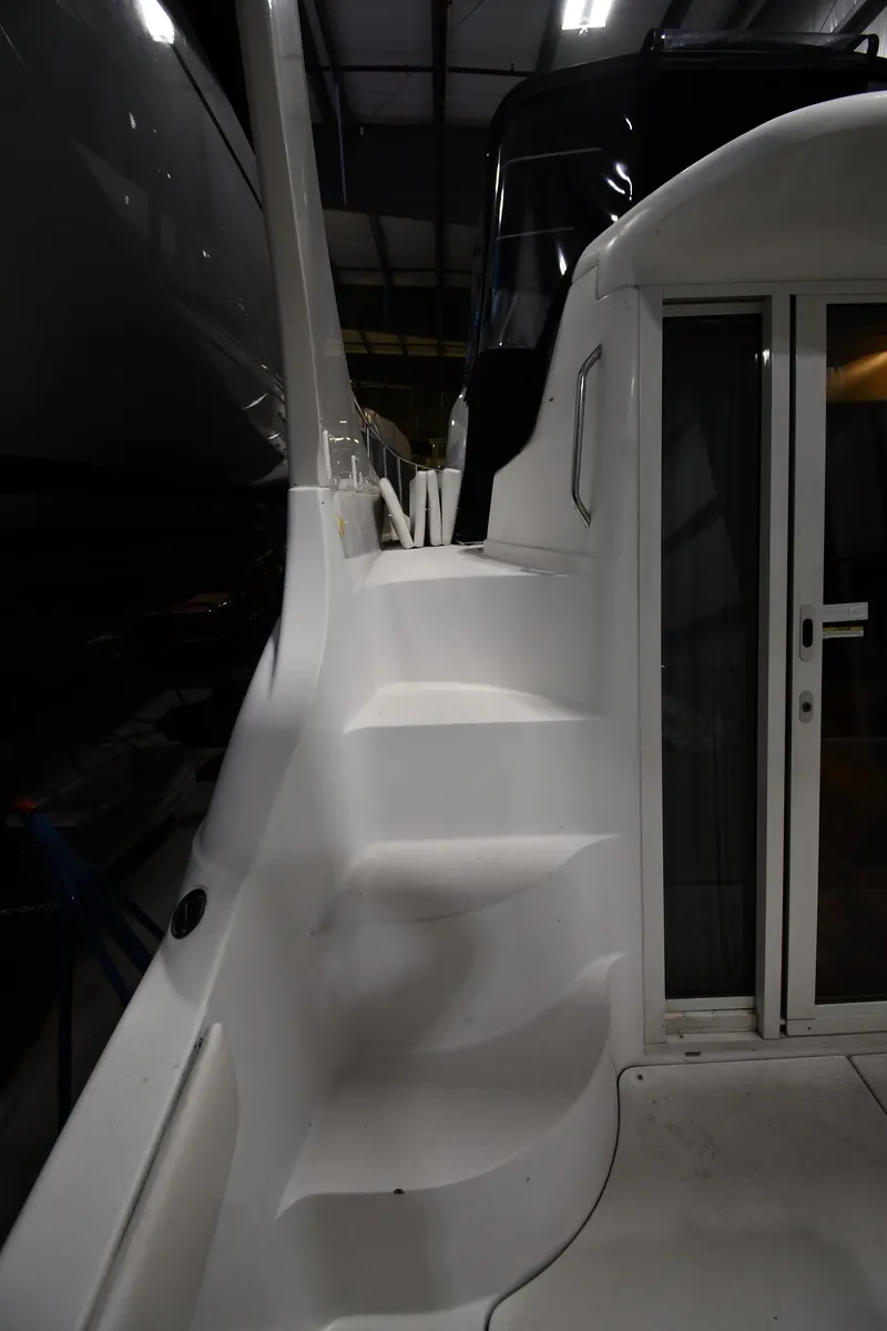 Slide: The Image of 2000 Carver 350 Mariner yacht interior with stairs and sliding door. - 25
