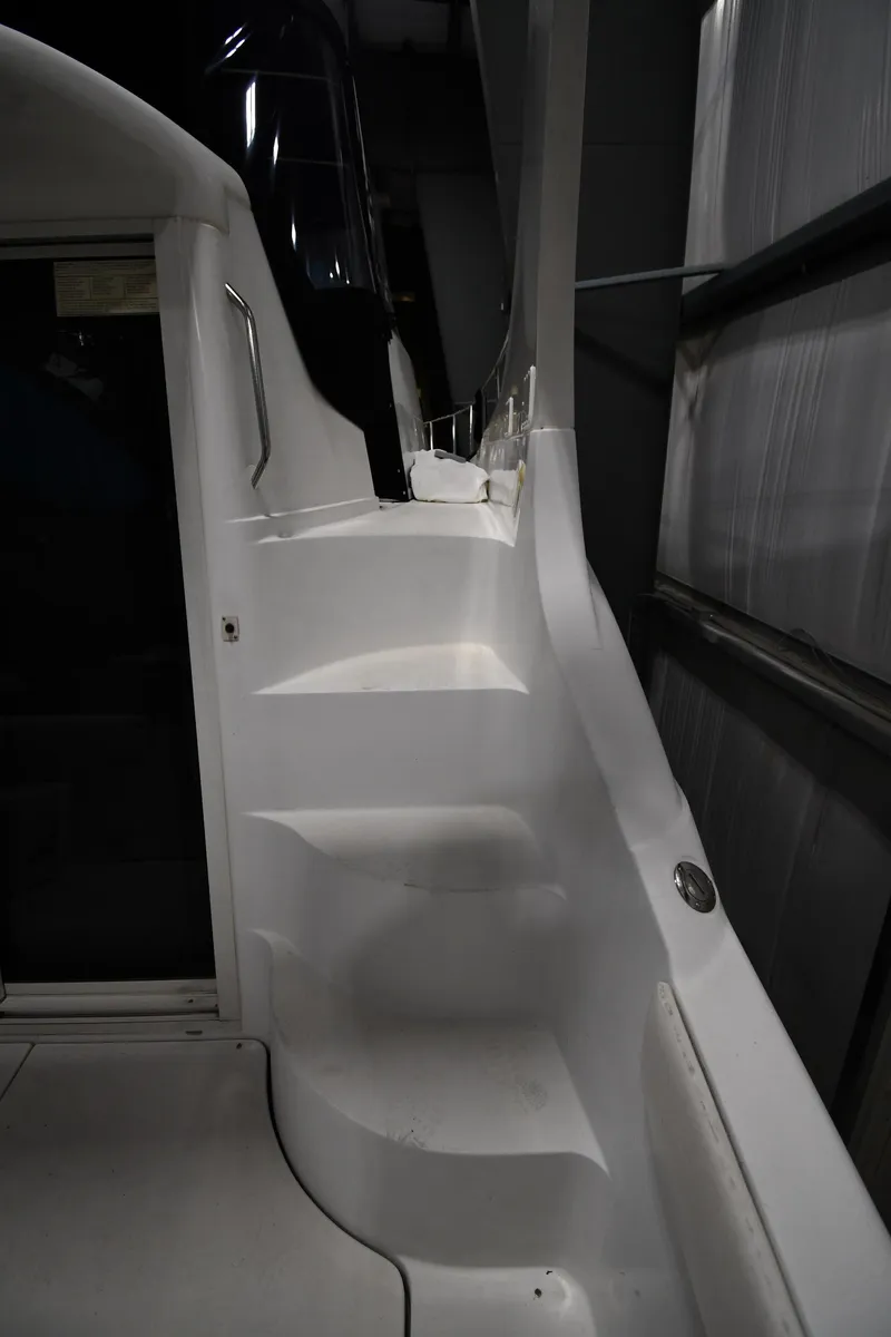 Slide: The Image of 2000 Carver 350 Mariner boat interior with white steps and sleek design. - 26