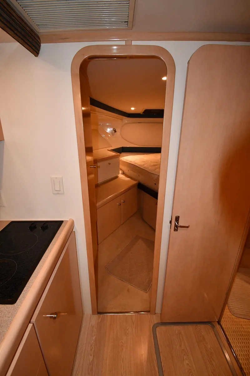 Slide: The Image of Interior view of 2000 Carver 350 Mariner yacht, featuring a cozy cabin and modern design. - 27