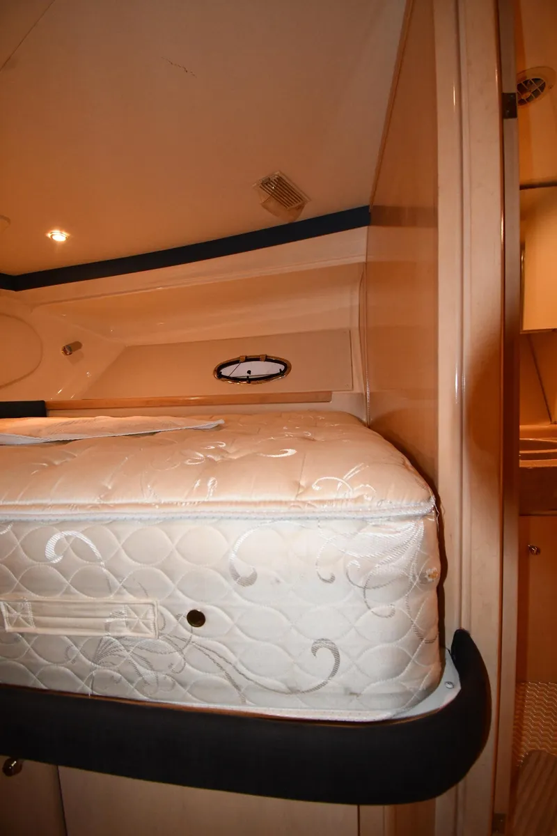 Slide: The Image of Interior view of 2000 Carver 350 Mariner yacht with mattress and porthole. - 29