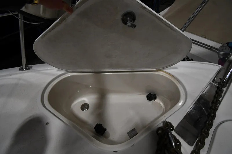 Slide: The Image of Open storage compartment on a 2000 Carver 350 Mariner boat deck. - 3