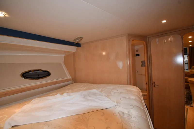 Slide: The Image of Interior cabin of 2000 Carver 350 Mariner yacht with bed and porthole. - 32