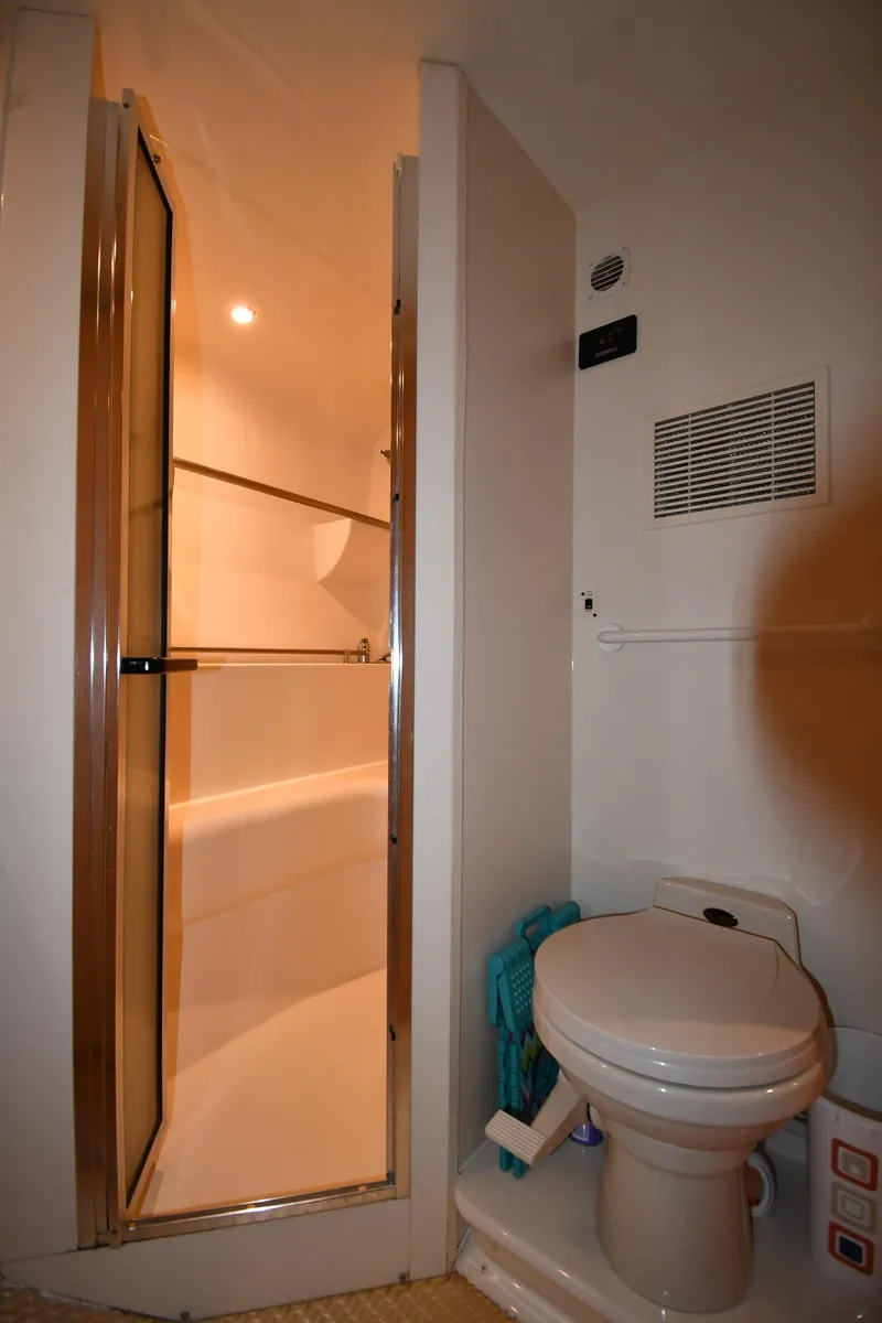 Slide: The Image of Bathroom interior of 2000 Carver 350 Mariner yacht with shower and toilet. - 34