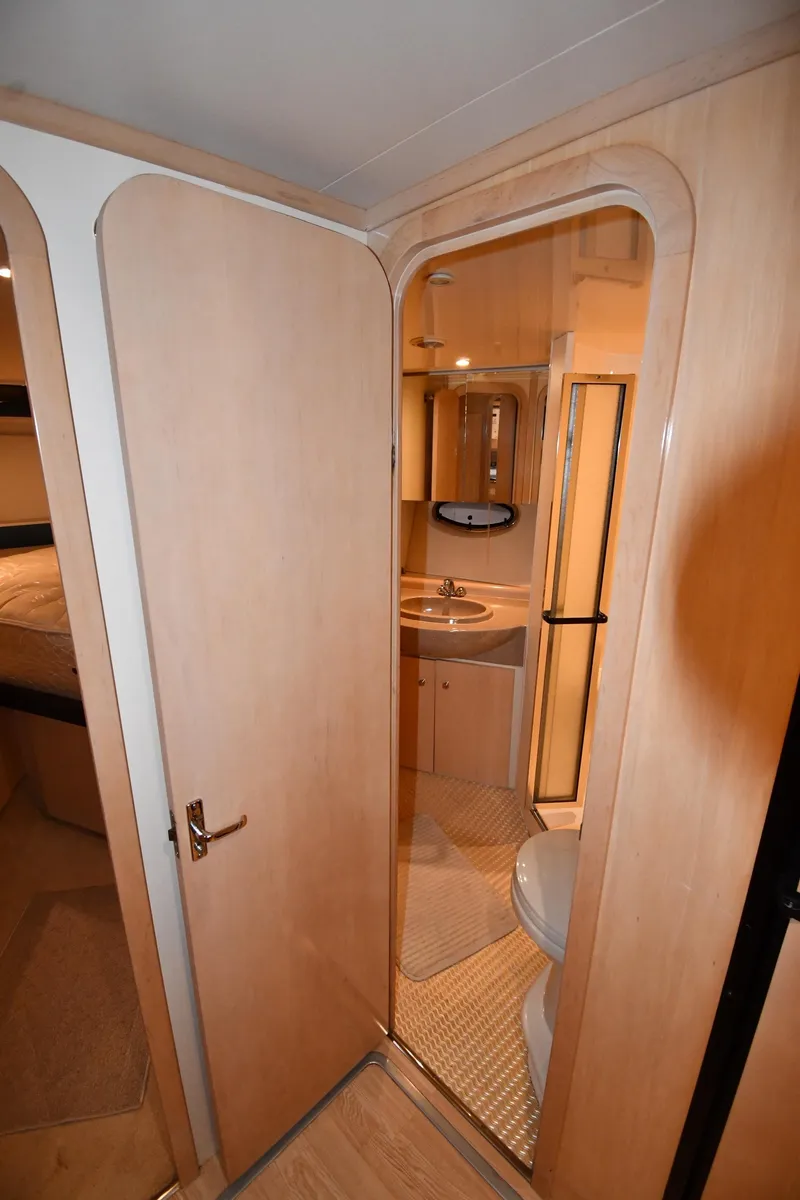 Slide: The Image of Interior view of 2000 Carver 350 Mariner bathroom with sink and toilet. - 35