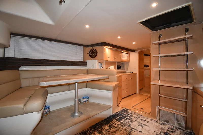 Slide: The Image of Interior of 2000 Carver 350 Mariner yacht with cozy seating and modern amenities. - 39