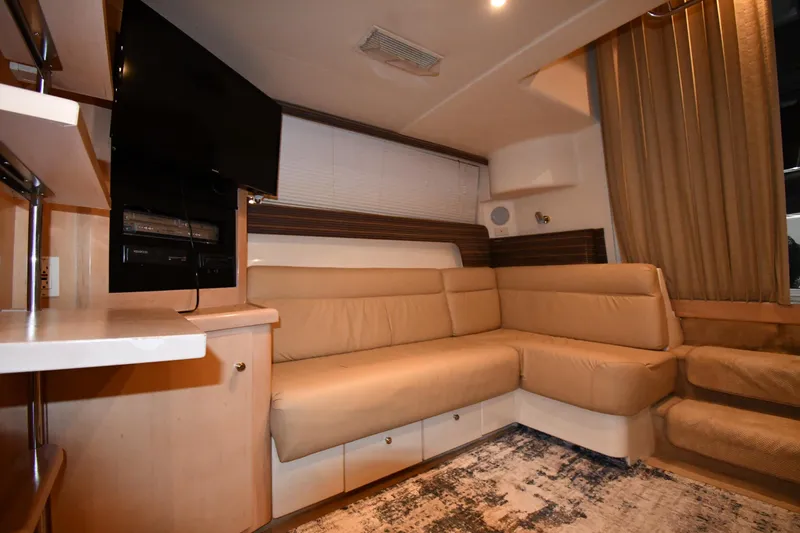 Slide: The Image of Interior of 2000 Carver 350 Mariner yacht with beige seating and modern decor. - 43