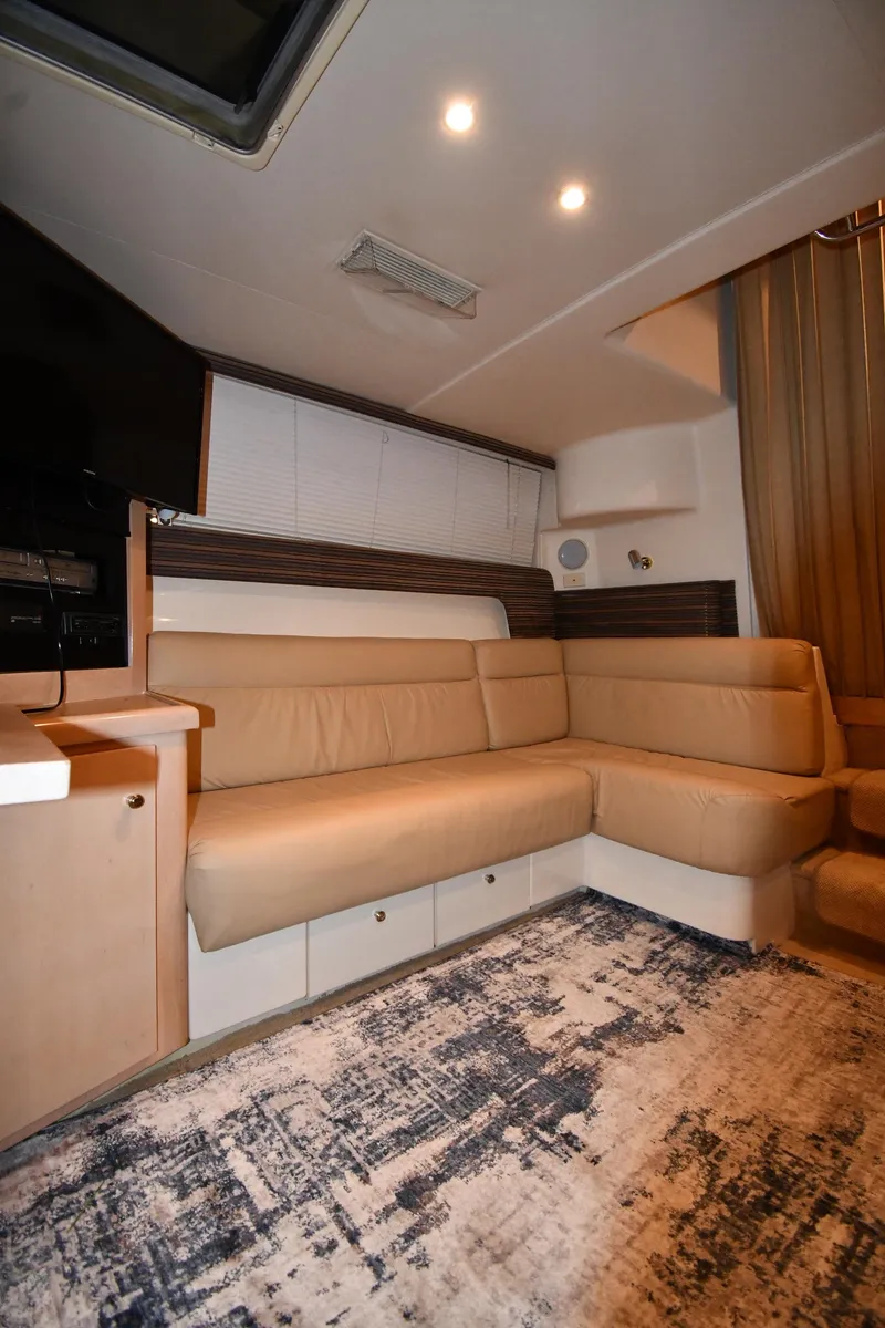 Slide: The Image of Interior of 2000 Carver 350 Mariner yacht with beige seating and modern decor. - 44