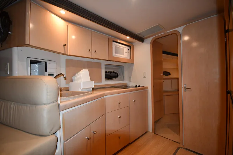 Slide: The Image of Interior of 2000 Carver 350 Mariner yacht with modern kitchen amenities. - 45