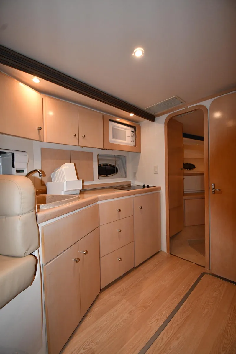 Slide: The Image of Interior of 2000 Carver 350 Mariner yacht with modern kitchen amenities. - 46