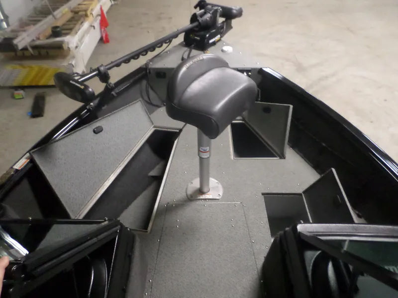 Slide: The Image of 2020 Lund IMPACT 1775 XS boat interior with seating and storage compartments. - 3