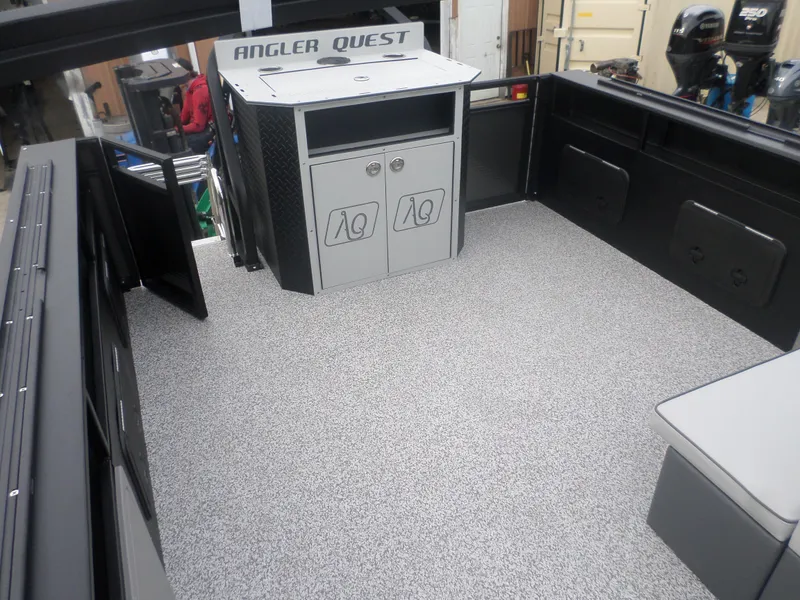 Slide: The Image of 2025 Angler Quest 8524 Family Fish boat interior with storage and seating. - 2