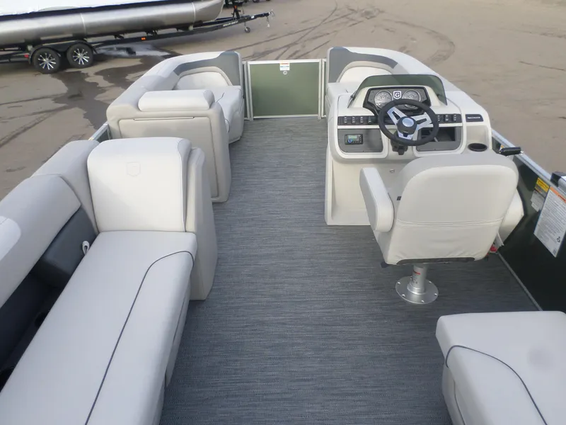 Slide: The Image of 2025 Godfrey Sweetwater 2086 SB pontoon boat interior with plush seating and modern helm. - 4