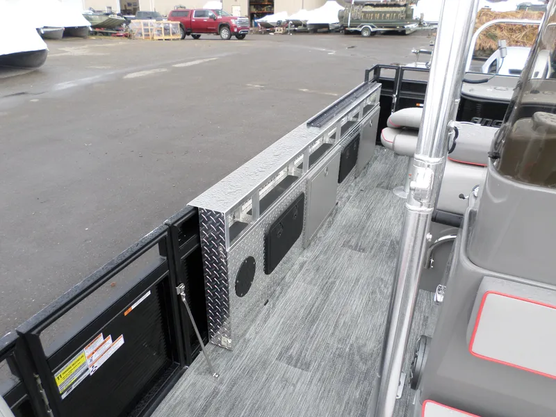 Slide: The Image of 2024 Angler Quest 8522/24 Pro Fish N Cruise interior with storage and seating. - 3