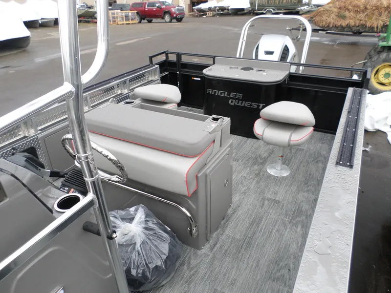 Slide: The Image of 2024 Angler Quest 8522/24 Pro Fish N Cruise boat interior with seating and fishing setup. - 8