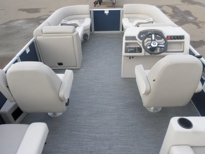 Slide: The Image of 2025 Godfrey Experience 2286 SBX pontoon boat interior with plush seating and modern helm. - 3