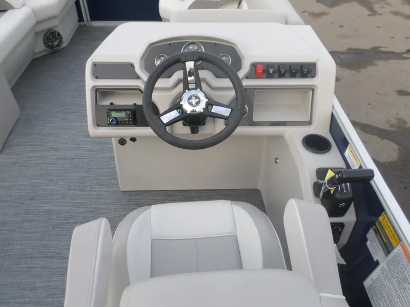 Slide: The Image of 2025 Godfrey Experience 2286 SBX boat dashboard with steering wheel and controls. - 4
