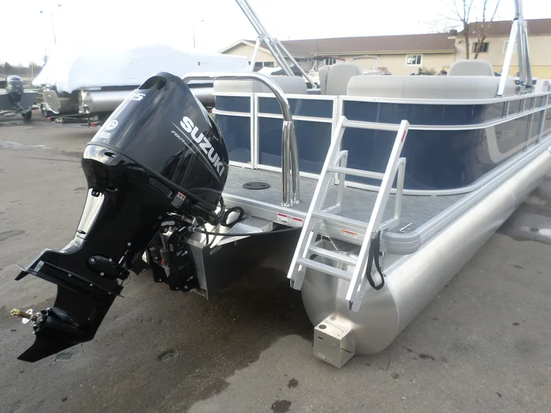 Slide: The Image of 2025 Godfrey Experience 2286 SBX pontoon boat with Suzuki outboard motor and boarding ladder. - 5