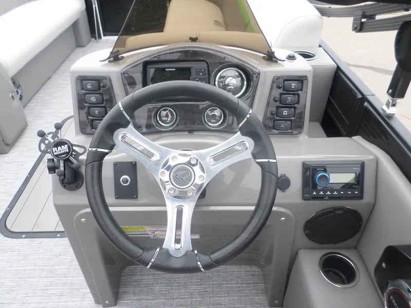 Slide: The Image of Steering console of 2023 Apex Qwest 822 XRE Cruise LT TRI boat with modern controls. - 6