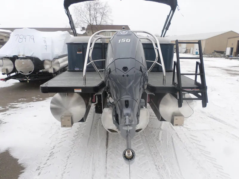 Slide: The Image of 2025 Godfrey Sweetwater 2286SB Tri pontoon boat with Yamaha 150 engine in snowy setting. - 5