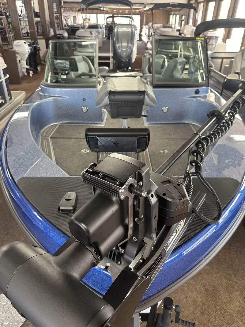 Slide: The Image of 2025 Warrior 208 DC boat interior with modern equipment and seating arrangement. - 4