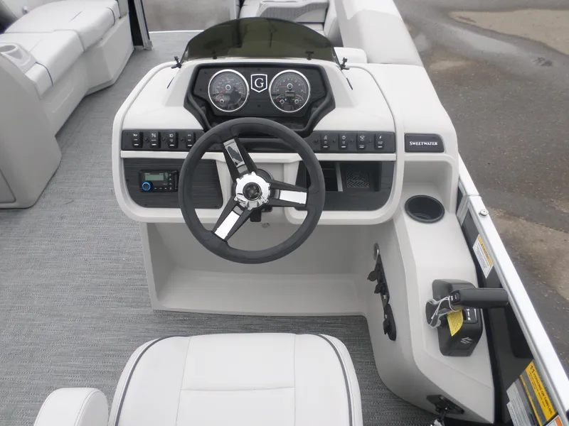 Slide: The Image of 2025 Godfrey Sweetwater 2086 CSE boat dashboard with steering wheel and controls. - 4
