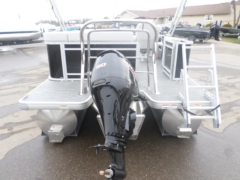 Slide: The Image of 2025 Godfrey Sweetwater 2086 CSE pontoon boat with outboard motor and ladder. - 6