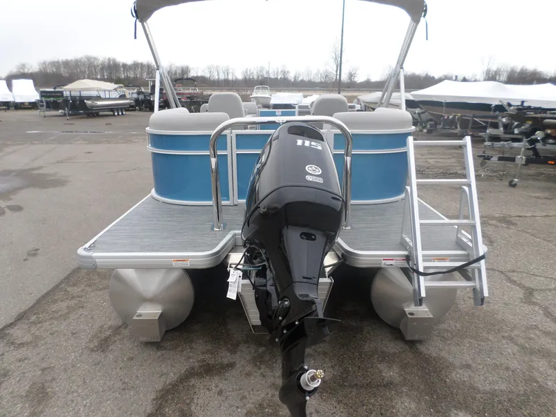 Slide: The Image of 2025 Godfrey Experience 2286 SBX pontoon boat with outboard motor, parked on a lot. - 3
