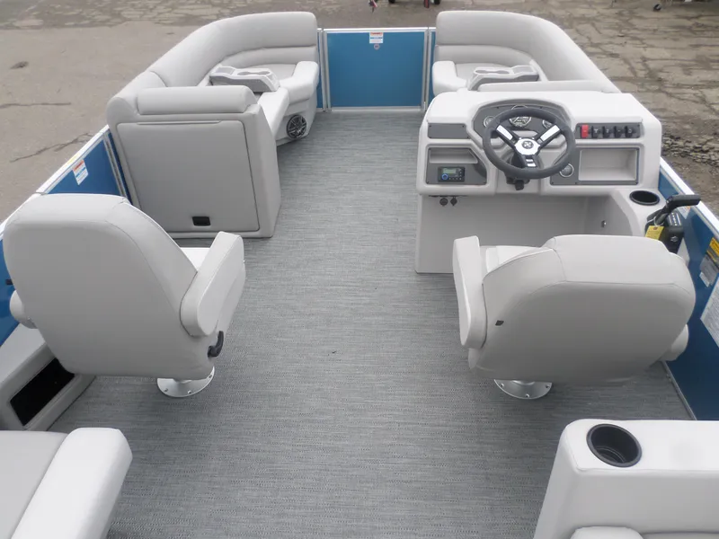 Slide: The Image of 2025 Godfrey Experience 2286 SBX pontoon boat interior with gray seating and steering console. - 4