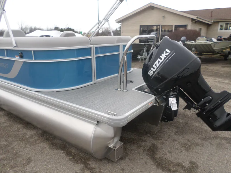 Slide: The Image of 2025 Godfrey Experience 2286 SBX pontoon boat with Suzuki outboard motor. - 6