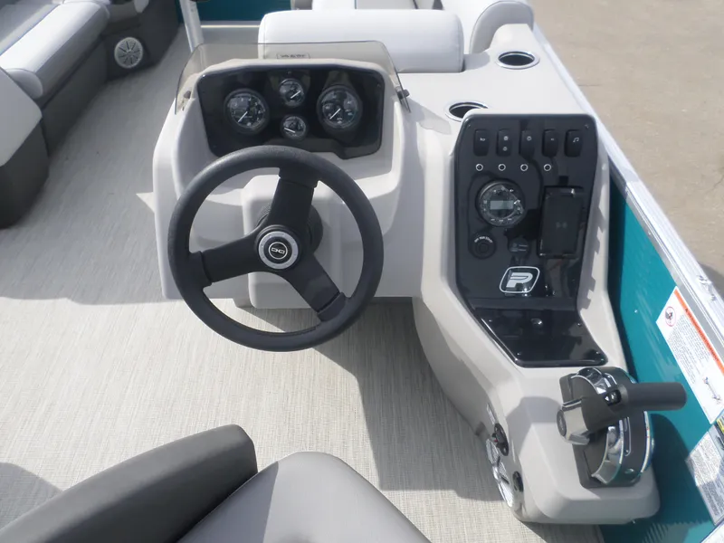 Slide: The Image of 2025 Princecraft Vectra 21 L boat dashboard with steering wheel and control panel. - 3