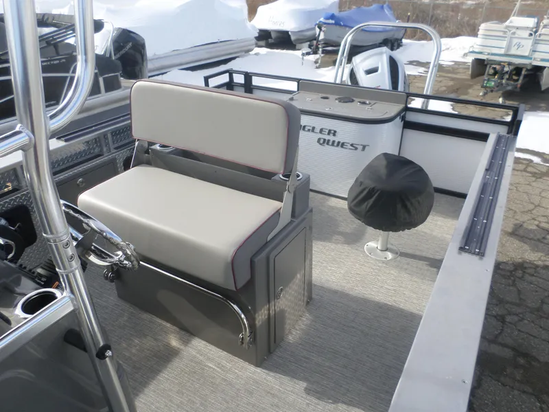 Slide: The Image of 2024 Angler Quest 8524/26 Pro Fish N Cruise boat interior with seating and controls. - 4