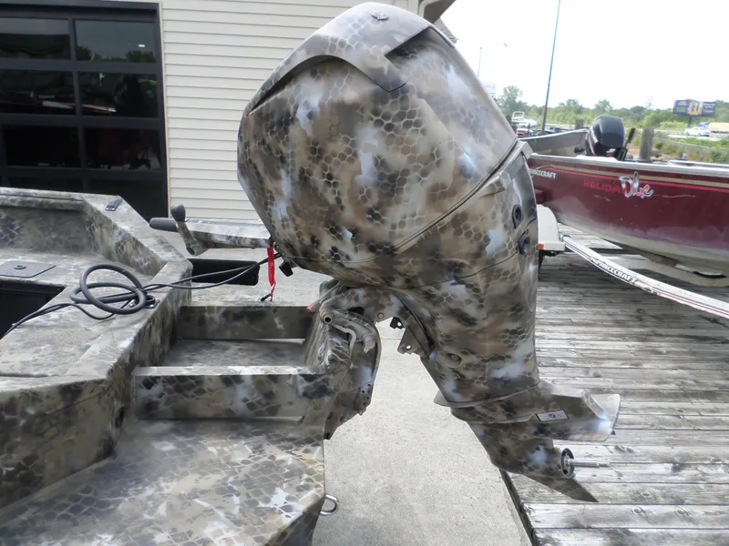 Slide: The Image of Camouflage-patterned outboard motor on Excel 1751 Viper boat, 2023 model. - 3
