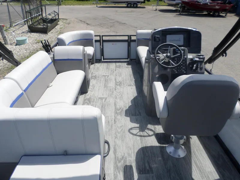 Slide: The Image of 2024 Angler Quest 8522 Pro Family Fish L interior with seating and steering console. - 5