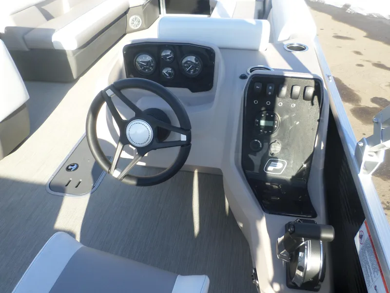 Slide: The Image of 2024 Princecraft Vectra 23 L TRI boat dashboard with steering wheel and control panel. - 4