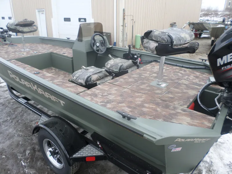 Slide: The Image of 2023 Polar Kraft Sportsman 1754 SC boat with camo seats and Mercury outboard motor. - 4