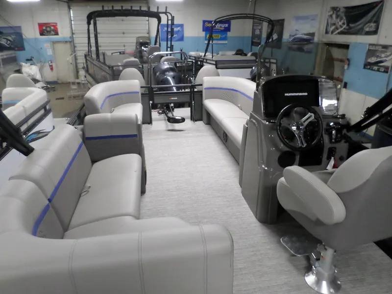 Slide: The Image of 2023 Angler Quest 8526 Family Fish Pro pontoon boat interior with seating and steering console. - 4