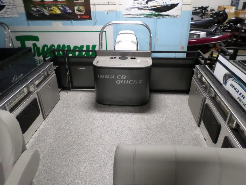 Slide: The Image of 2023 Angler Quest 8526 Family Fish Pro interior with seating and storage compartments. - 5