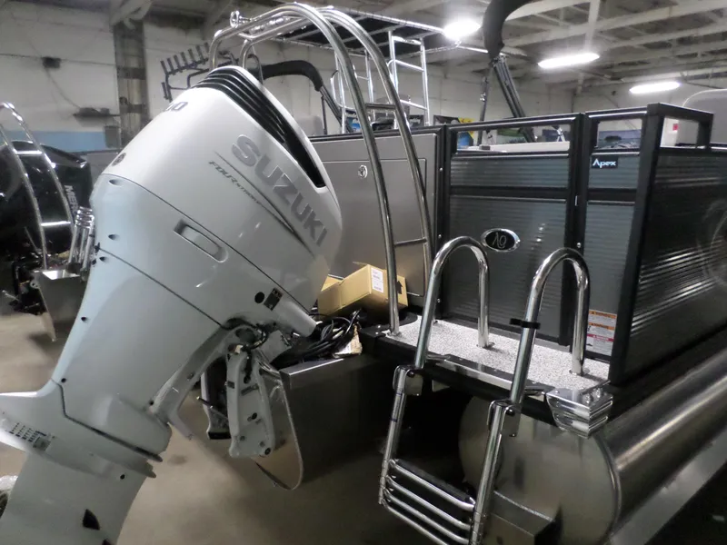 Slide: The Image of 2023 Angler Quest 8526 Family Fish Pro with Suzuki outboard motor in a showroom. - 6