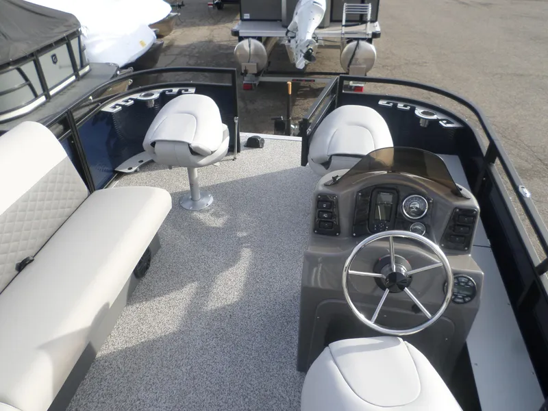 Slide: The Image of 2025 Angler Quest 814 Panfish boat interior with steering console and seating. - 3