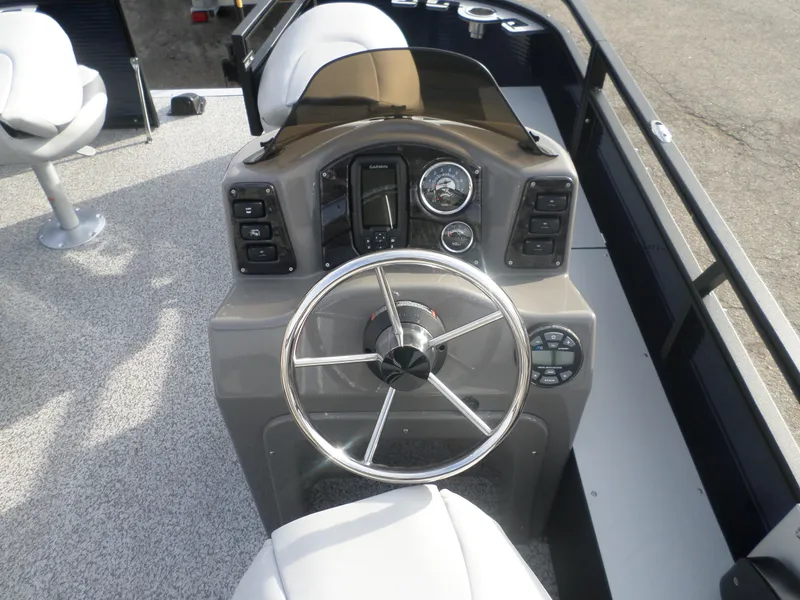 Slide: The Image of 2025 Angler Quest 814 Panfish boat dashboard with steering wheel and control panel. - 4