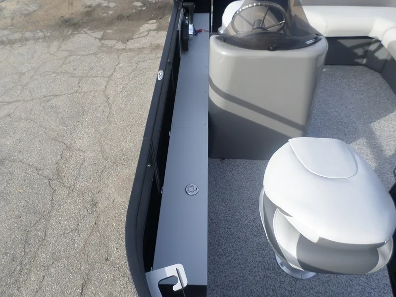 Slide: The Image of 2025 Angler Quest 814 Panfish boat interior with seating and steering console. - 5