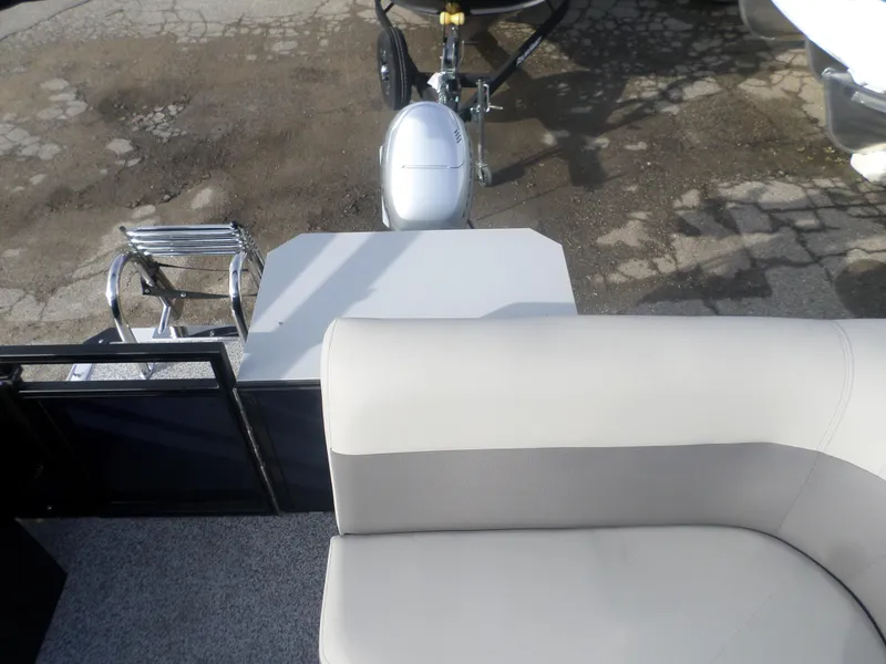 Slide: The Image of 2025 Angler Quest 814 Panfish boat interior with seating and motor view. - 8