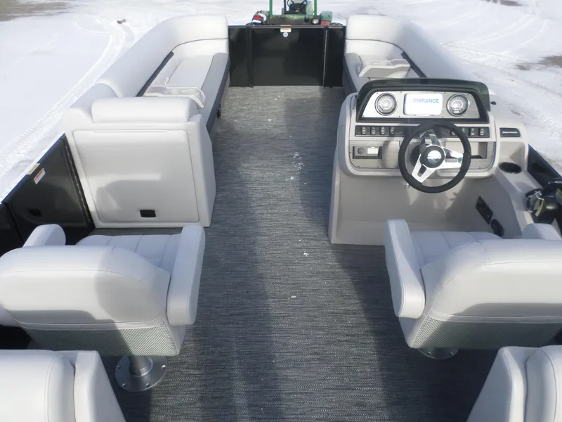Slide: The Image of 2025 Godfrey Sweetwater 2286SB Tri pontoon boat interior with modern seating and steering console. - 4