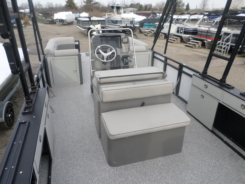 Slide: The Image of 2025 Angler Quest 8524 Pro Troll boat interior with seating and steering console. - 3