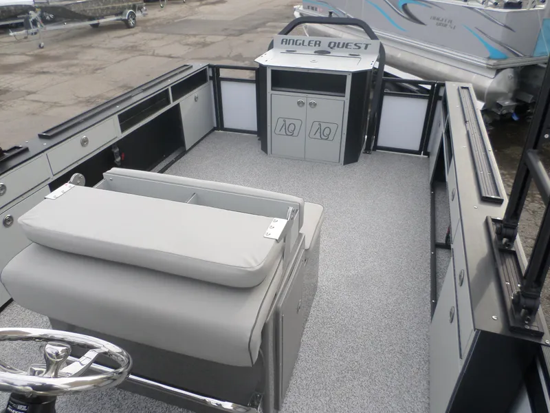 Slide: The Image of 2025 Angler Quest 8524 Pro Troll boat interior with seating and storage compartments. - 6