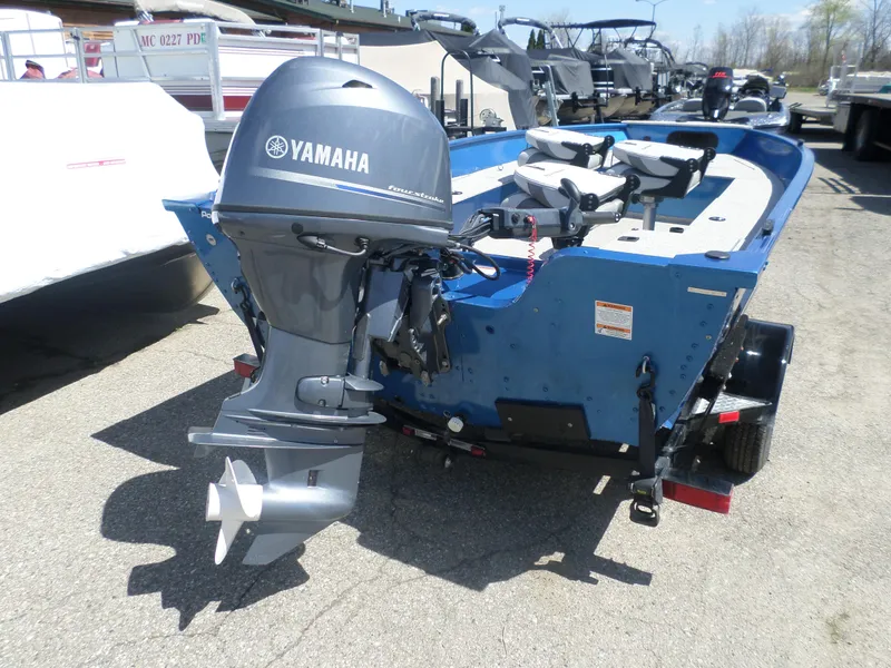 Slide: The Image of 2021 Polar Kraft OLV 156 T boat with Yamaha outboard motor, parked on a trailer. - 3