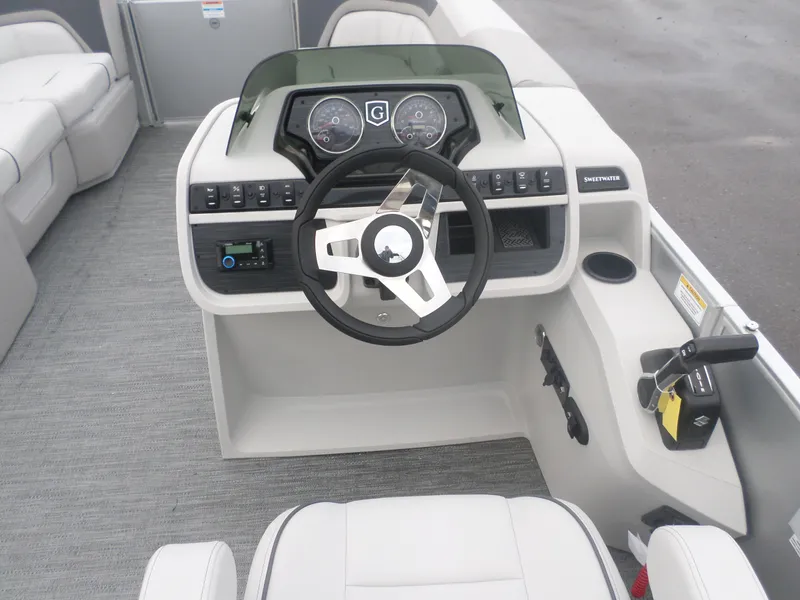 Slide: The Image of 2025 Godfrey Sweetwater 2086 SB boat dashboard with steering wheel and controls. - 5
