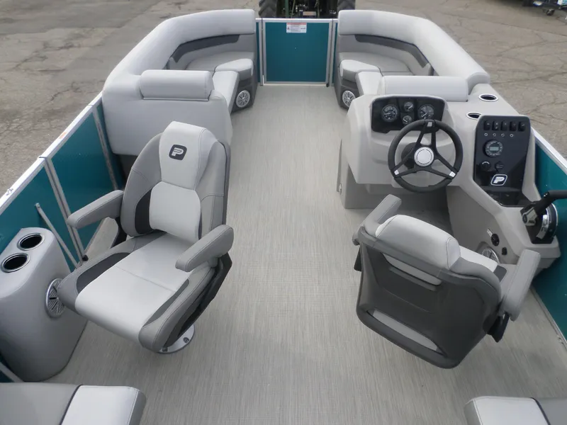 Slide: The Image of 2025 Princecraft Vectra 23 XT pontoon boat interior with modern seating and steering console. - 4
